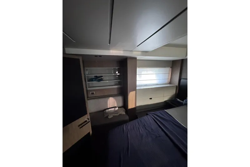  Yacht Photos Pics Interior cabin of 2022 Cranchi T55 Trawler with modern design and window view.
