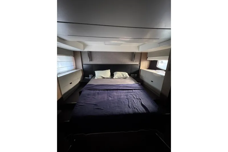  Yacht Photos Pics Luxurious bedroom interior of 2022 Cranchi T55 Trawler yacht with modern design.