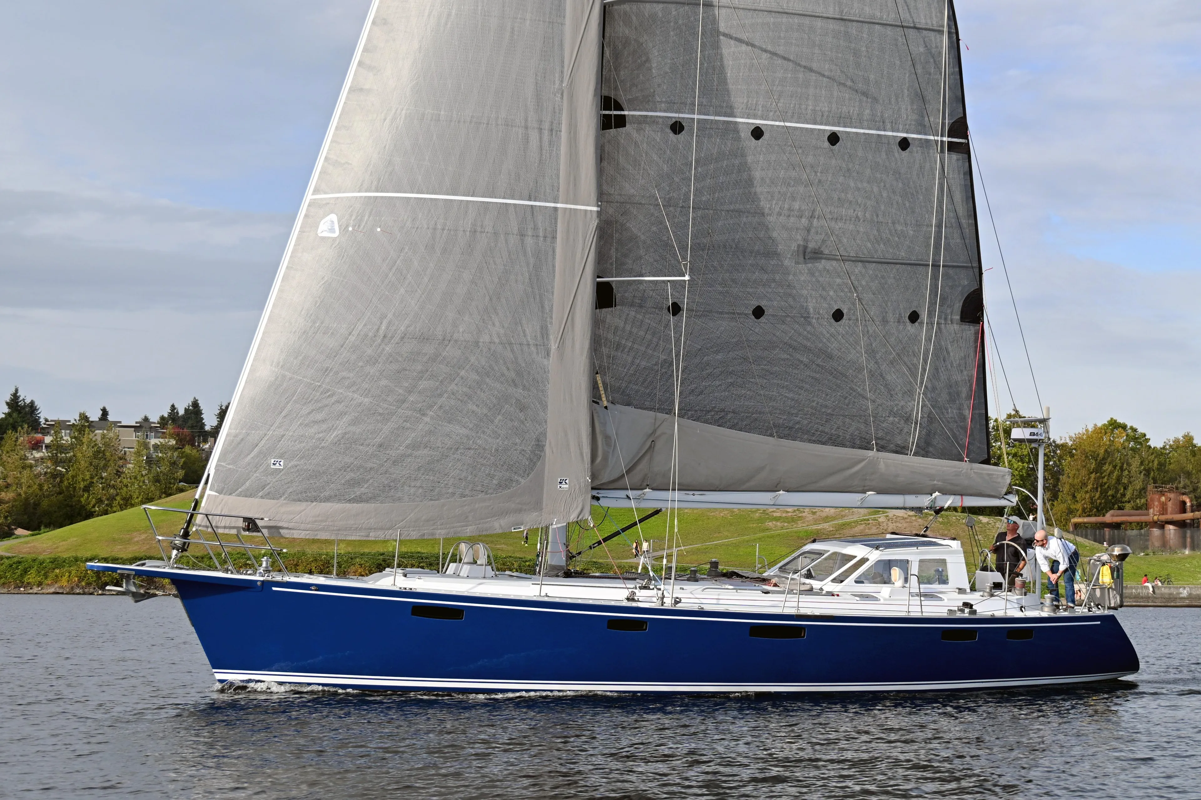 Sailing yacht Able Apogee 50, 1995 model, with blue hull and large sails on water.