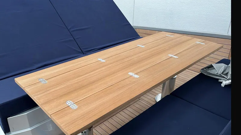  Yacht Photos Pics Wooden table on Wally Tender 48 yacht, 2019 model, with blue seating.
