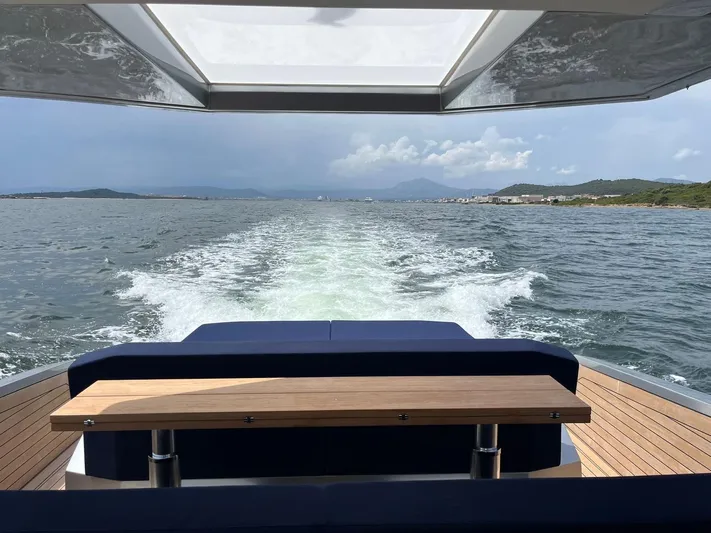  Yacht Photos Pics Wally Tender 48 yacht cruising on open water, showcasing sleek design and luxury seating.