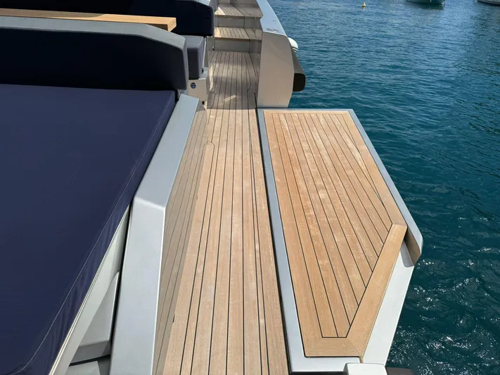  Yacht Photos Pics Wally Tender 48 yacht deck with wooden finish, 2019 model, on clear blue water.