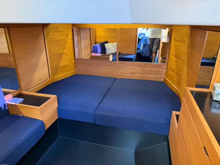  Yacht Photos Pics Interior of 2019 Wally Tender 48 yacht with blue seating and wooden paneling.
