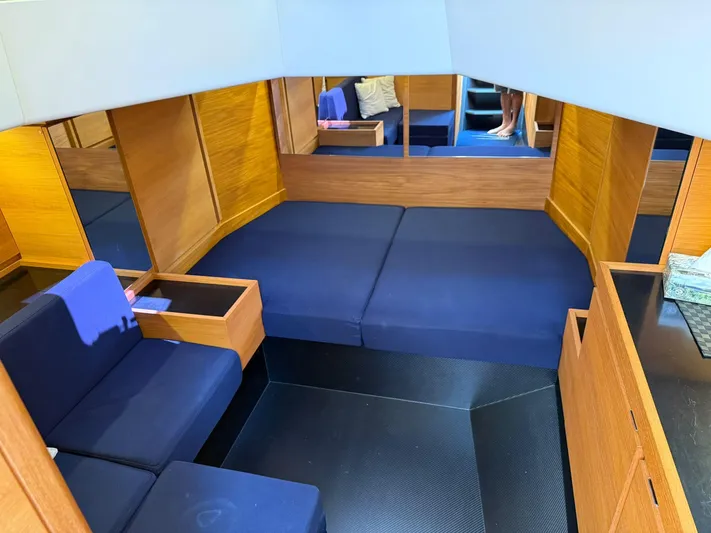  Yacht Photos Pics Interior of 2019 Wally WALLY TENDER 48 with blue seating and wooden accents.