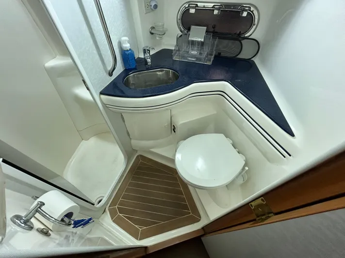  Yacht Photos Pics Sealine F44 2000 yacht bathroom with sink, toilet, and shower.