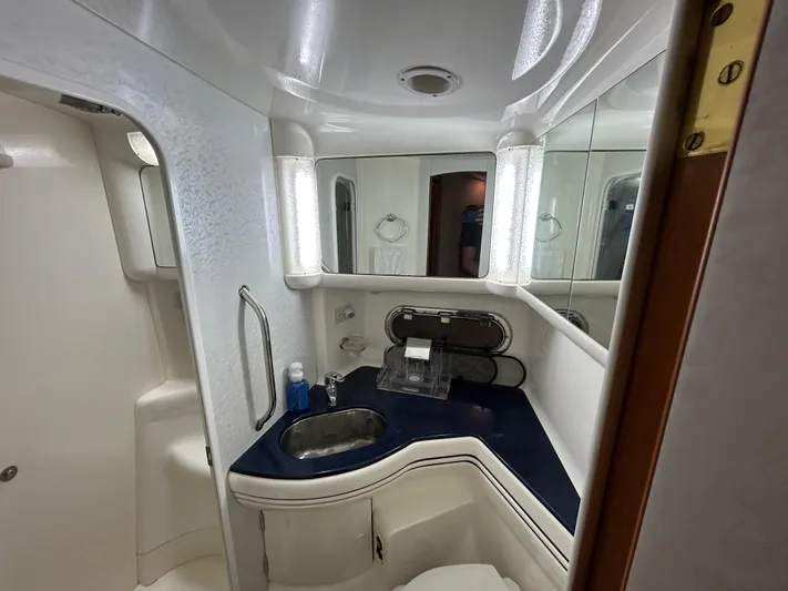  Yacht Photos Pics Luxurious bathroom in 2000 Sealine F44 yacht with modern fixtures and elegant design.