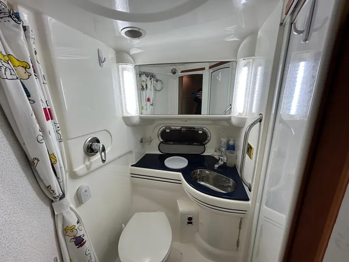 Yacht Photos Pics Bathroom interior of 2000 Sealine F44 yacht, featuring modern fixtures and compact design.