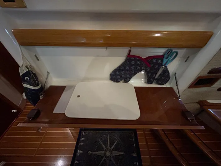  Yacht Photos Pics Interior of 2000 Sealine F44 yacht with wooden countertop and kitchen accessories.