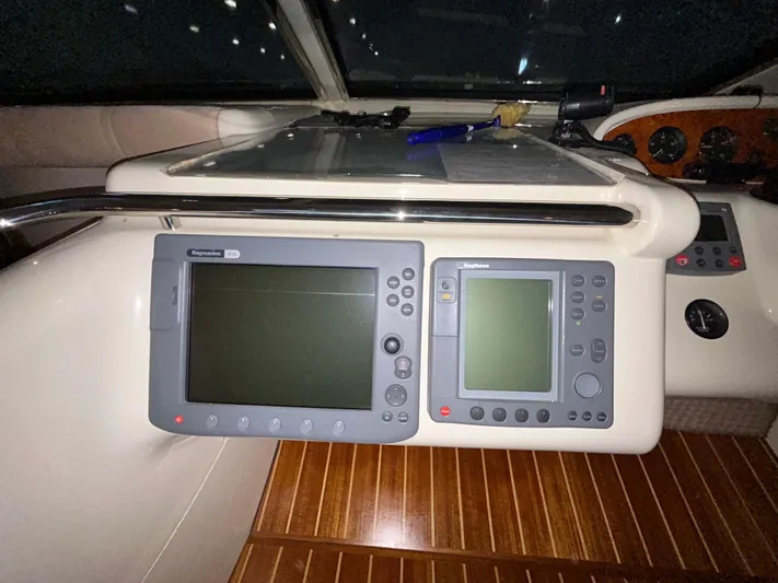  Yacht Photos Pics Control panel of a 2000 Sealine F44 yacht with navigation screens.