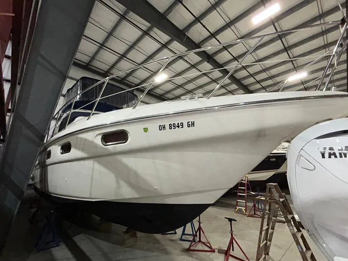  Yacht Photos Pics 2000 Sealine F44 yacht in storage, side view, indoors.