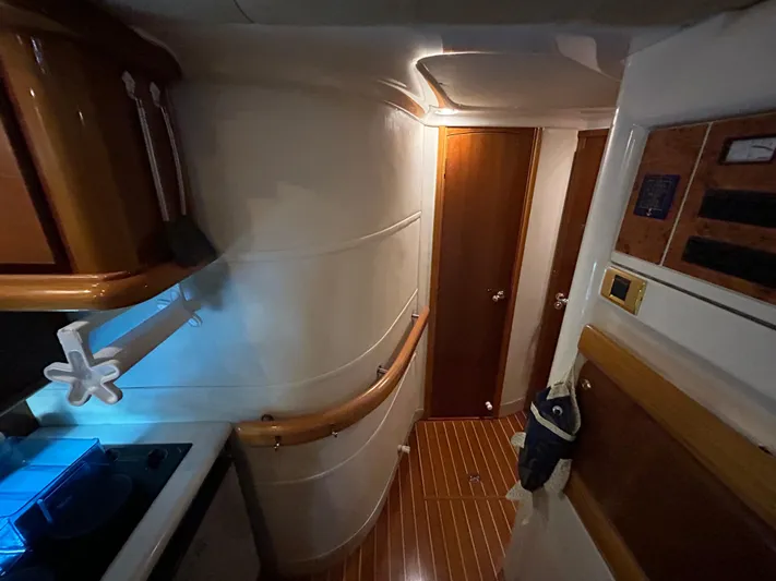  Yacht Photos Pics Interior of 2000 Sealine F44 yacht, featuring wooden flooring and modern cabinetry.