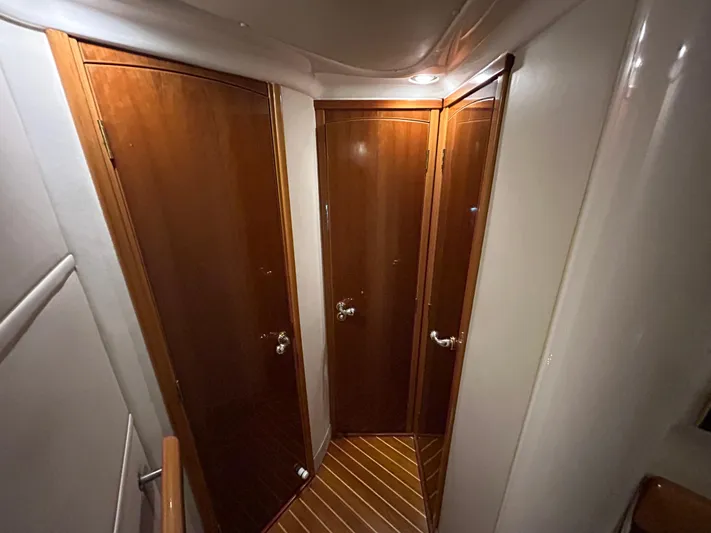  Yacht Photos Pics Hallway with wooden doors inside a 2000 Sealine F44 yacht.