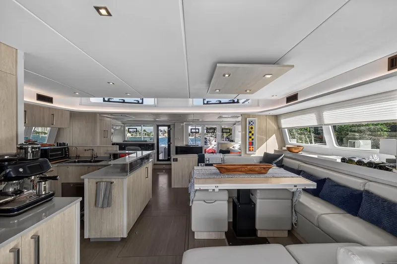  Yacht Photos Pics Luxurious interior of 2019 Leopard 58 yacht with modern kitchen and seating area.
