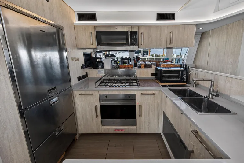  Yacht Photos Pics Modern kitchen in a 2019 Leopard 58 yacht with stainless steel appliances.