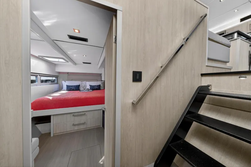  Yacht Photos Pics Luxurious 2019 Leopard 58 yacht interior with modern bedroom and sleek staircase design.