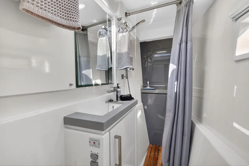  Yacht Photos Pics Modern bathroom interior on 2019 Leopard 58 yacht, featuring sleek design and elegant fixtures.