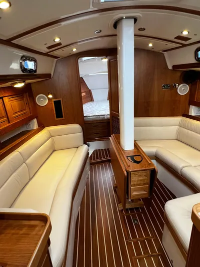 395 Yacht Photos Pics Luxurious interior of 2025 Tartan 395 yacht with elegant wood finish and plush seating.