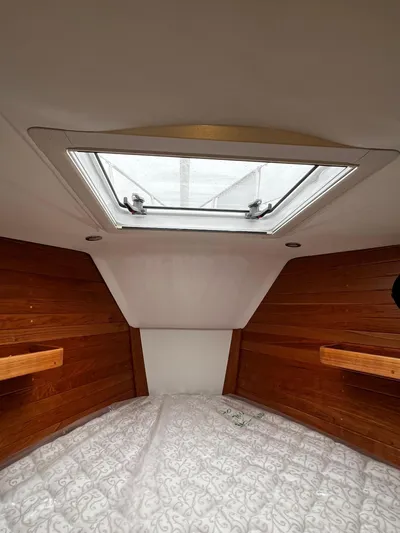 395 Yacht Photos Pics Interior cabin of 2025 Tartan 395 yacht with wooden paneling and skylight.