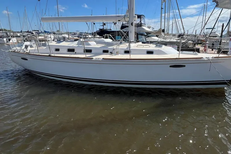 395 Yacht Photos Pics 2025 Tartan 395 sailboat docked in a marina under a clear blue sky.