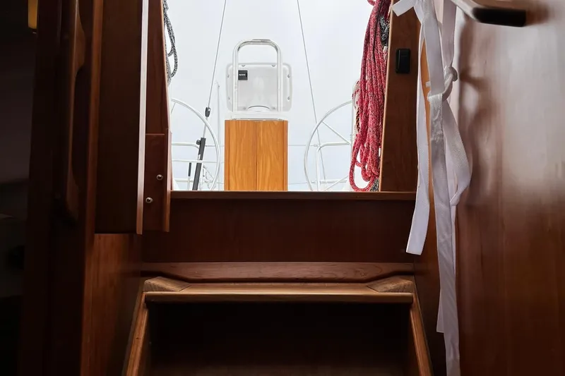 395 Yacht Photos Pics Interior view of 2025 Tartan 395 sailboat, showcasing wooden steps and cockpit entrance.