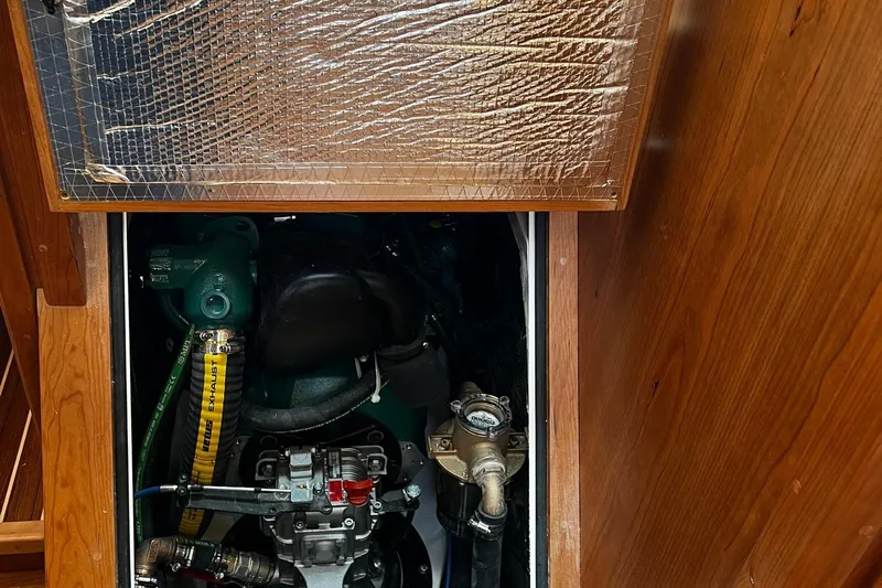 395 Yacht Photos Pics Engine compartment of 2025 Tartan 395 sailboat, showcasing mechanical components and insulation.