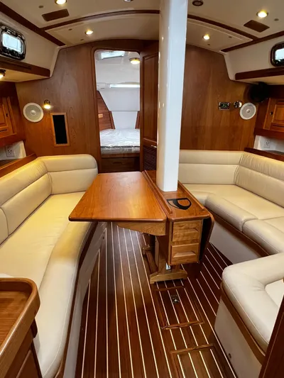 395 Yacht Photos Pics Luxurious interior of 2025 Tartan 395 yacht with elegant wood finish and plush seating.