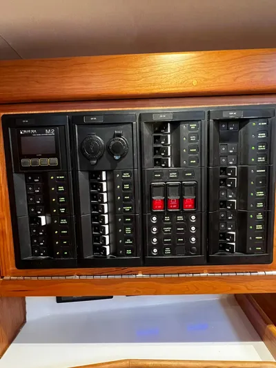 395 Yacht Photos Pics Control panel of a 2025 Tartan 395 yacht with various switches and dials.