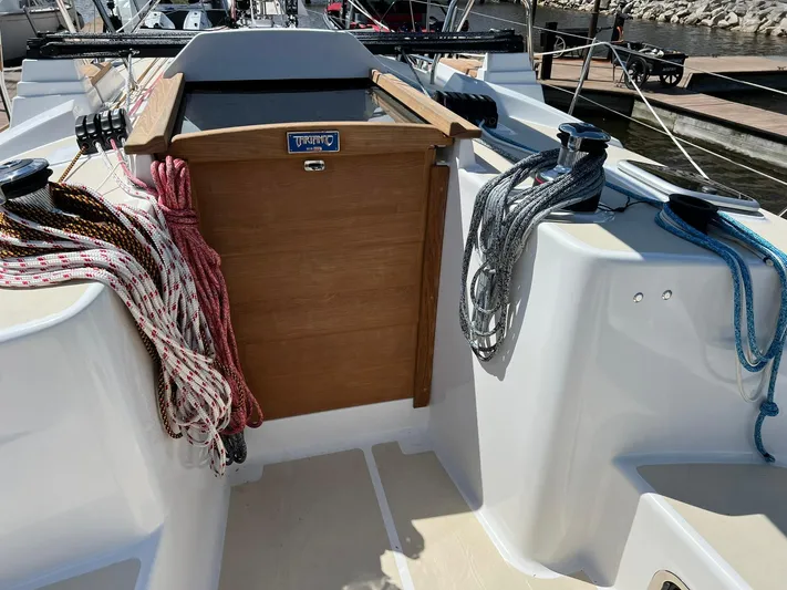 395 Yacht Photos Pics 2025 Tartan 395 sailboat cockpit with ropes and wooden hatch.