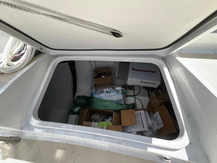 395 Yacht Photos Pics Open storage compartment on 2025 Tartan 395 yacht with Raymarine equipment and supplies.