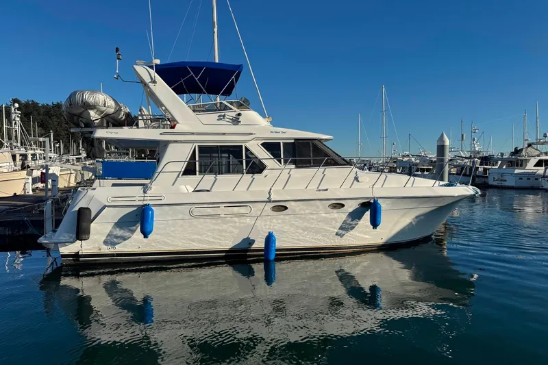 It's About Time Yacht Photos Pics Californian 39 yacht, 2001 model, docked in a marina under clear blue skies.