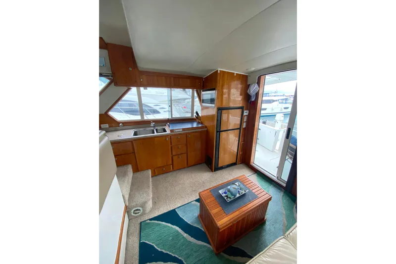 It's About Time Yacht Photos Pics Interior of 2001 Californian 39 yacht with kitchenette and seating area.
