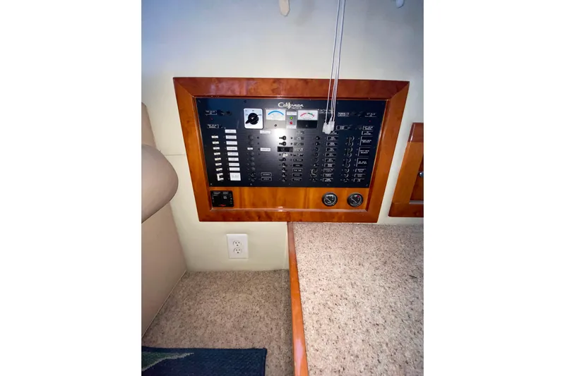 It's About Time Yacht Photos Pics Electrical panel of a 2001 Californian 39 yacht, featuring switches and gauges.