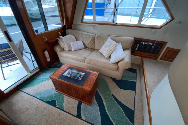 It's About Time Yacht Photos Pics Cozy interior of 2001 Californian 39 yacht with sofa and nautical decor.