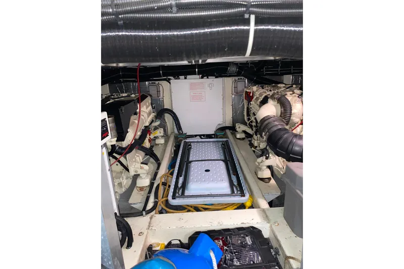 It's About Time Yacht Photos Pics Engine room of a 2001 Californian 39 yacht, showcasing mechanical components and wiring.