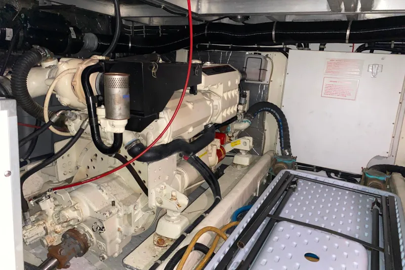 It's About Time Yacht Photos Pics Engine room of a 2001 Californian 39 yacht, showcasing mechanical components and wiring.