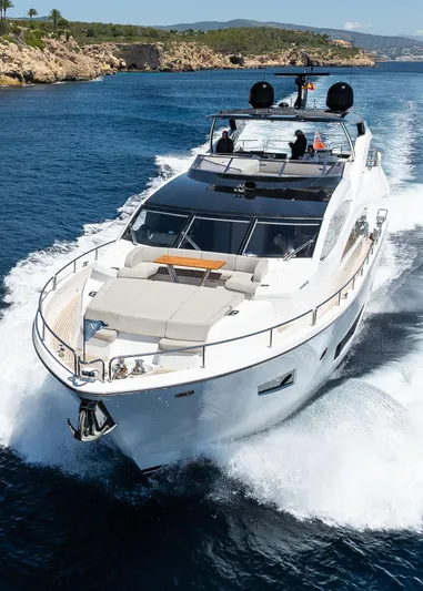 Seawater Yacht Photos Pics 2019 Sunseeker 86 Yacht cruising on open water, showcasing luxury and elegance.