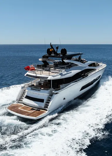 Seawater Yacht Photos Pics 2019 Sunseeker 86 Yacht cruising on open sea under clear blue sky.