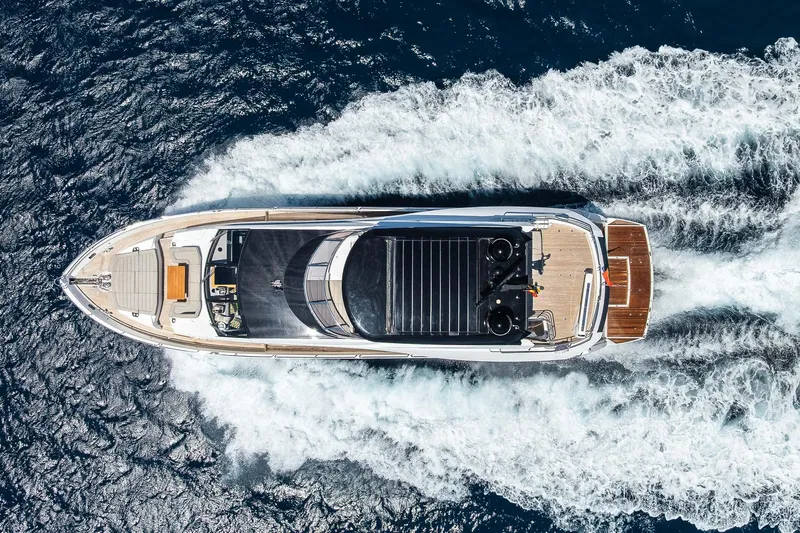 Seawater Yacht Photos Pics Aerial view of 2019 Sunseeker 86 Yacht cruising on open water.