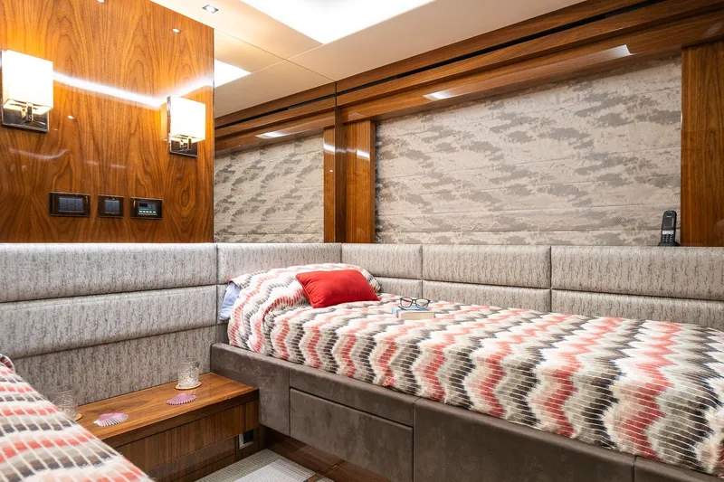 Seawater Yacht Photos Pics Luxurious cabin interior of 2019 Sunseeker 86 Yacht with twin beds and elegant decor.