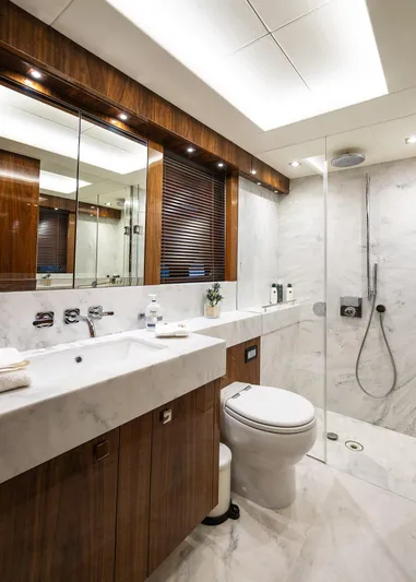 Seawater Yacht Photos Pics Luxurious bathroom on 2019 Sunseeker 86 Yacht with marble and wood finishes.