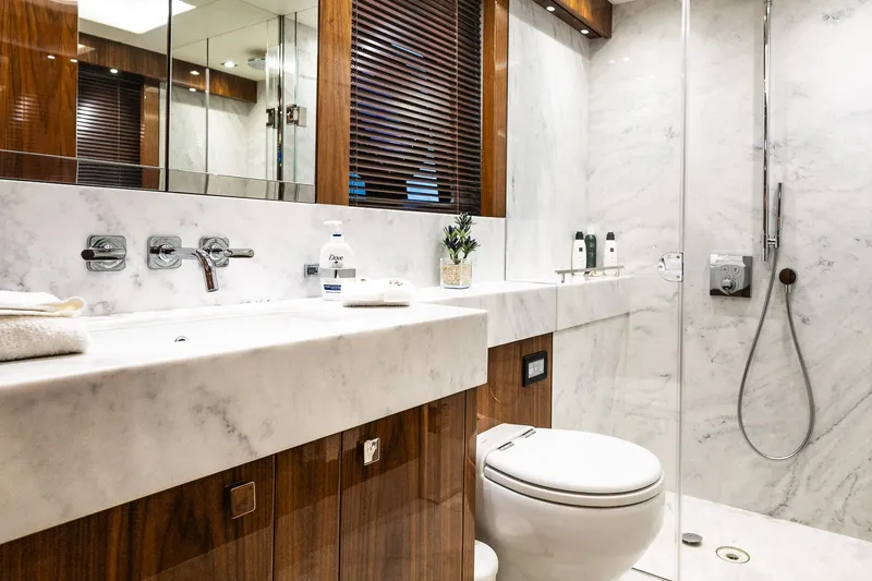 Seawater Yacht Photos Pics Luxurious bathroom in 2019 Sunseeker 86 Yacht with marble and wood finishes.