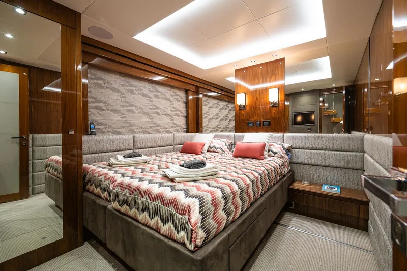 Seawater Yacht Photos Pics Luxurious bedroom interior of 2019 Sunseeker 86 Yacht with modern decor and ambient lighting.
