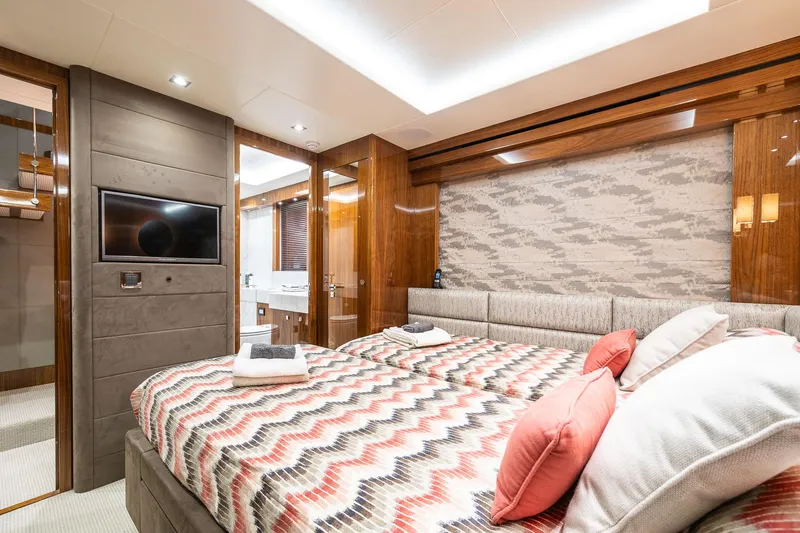 Seawater Yacht Photos Pics Luxurious bedroom interior of 2019 Sunseeker 86 Yacht with modern decor and amenities.
