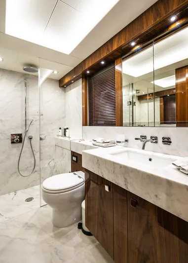 Seawater Yacht Photos Pics Luxurious bathroom in 2019 Sunseeker 86 Yacht with marble and wood finishes.