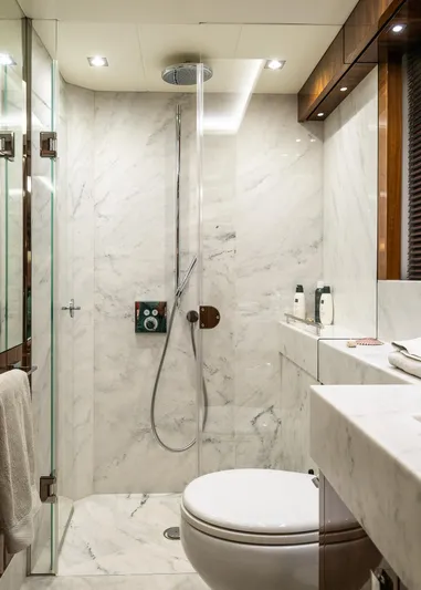 Seawater Yacht Photos Pics Luxurious marble bathroom on 2019 Sunseeker 86 Yacht with modern shower and fixtures.