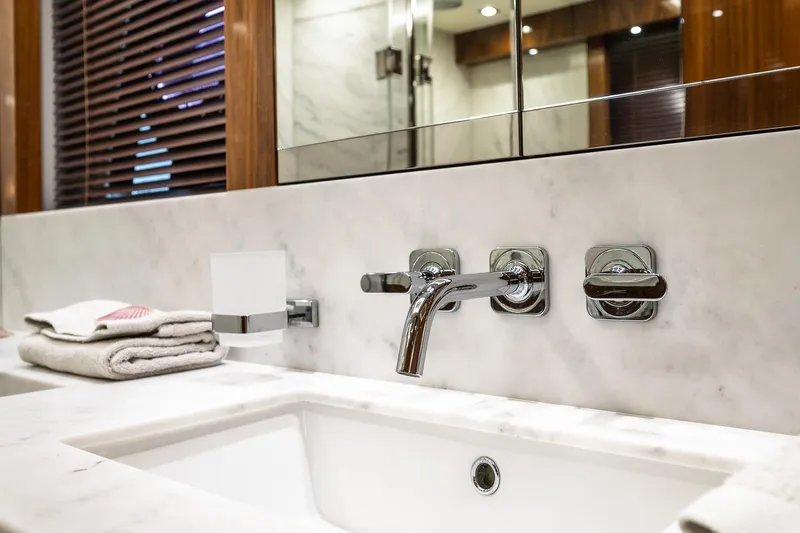Seawater Yacht Photos Pics Luxurious bathroom sink with marble countertop on 2019 Sunseeker 86 Yacht.