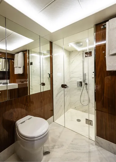 Seawater Yacht Photos Pics Luxurious bathroom on 2019 Sunseeker 86 Yacht with glass shower and modern fixtures.