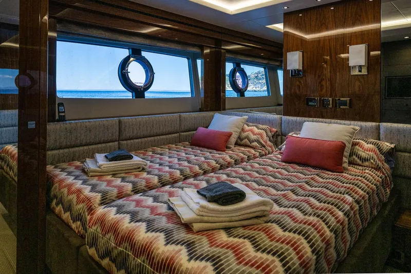 Seawater Yacht Photos Pics Luxurious 2019 Sunseeker 86 Yacht bedroom with twin beds, ocean view, and elegant decor.