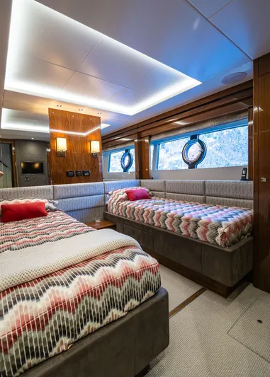 Seawater Yacht Photos Pics Luxurious 2019 Sunseeker 86 Yacht cabin with twin beds and elegant decor.