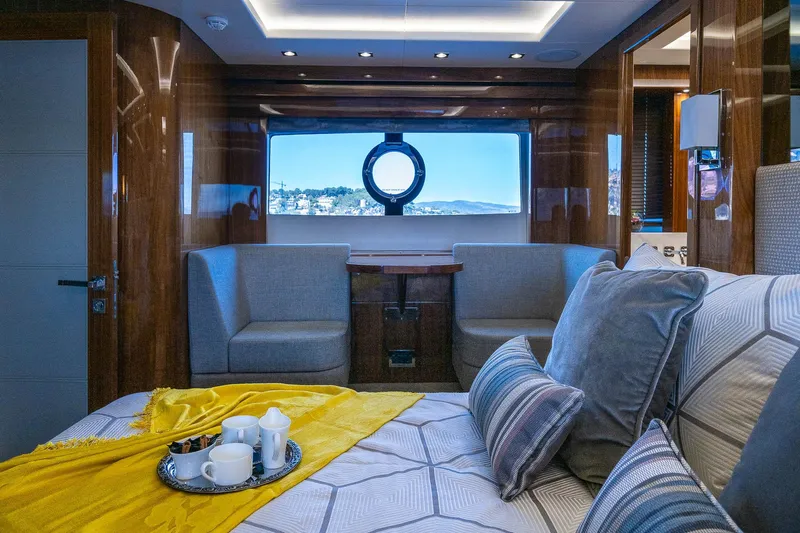 Seawater Yacht Photos Pics Luxurious interior of 2019 Sunseeker 86 Yacht with elegant seating and bedding.
